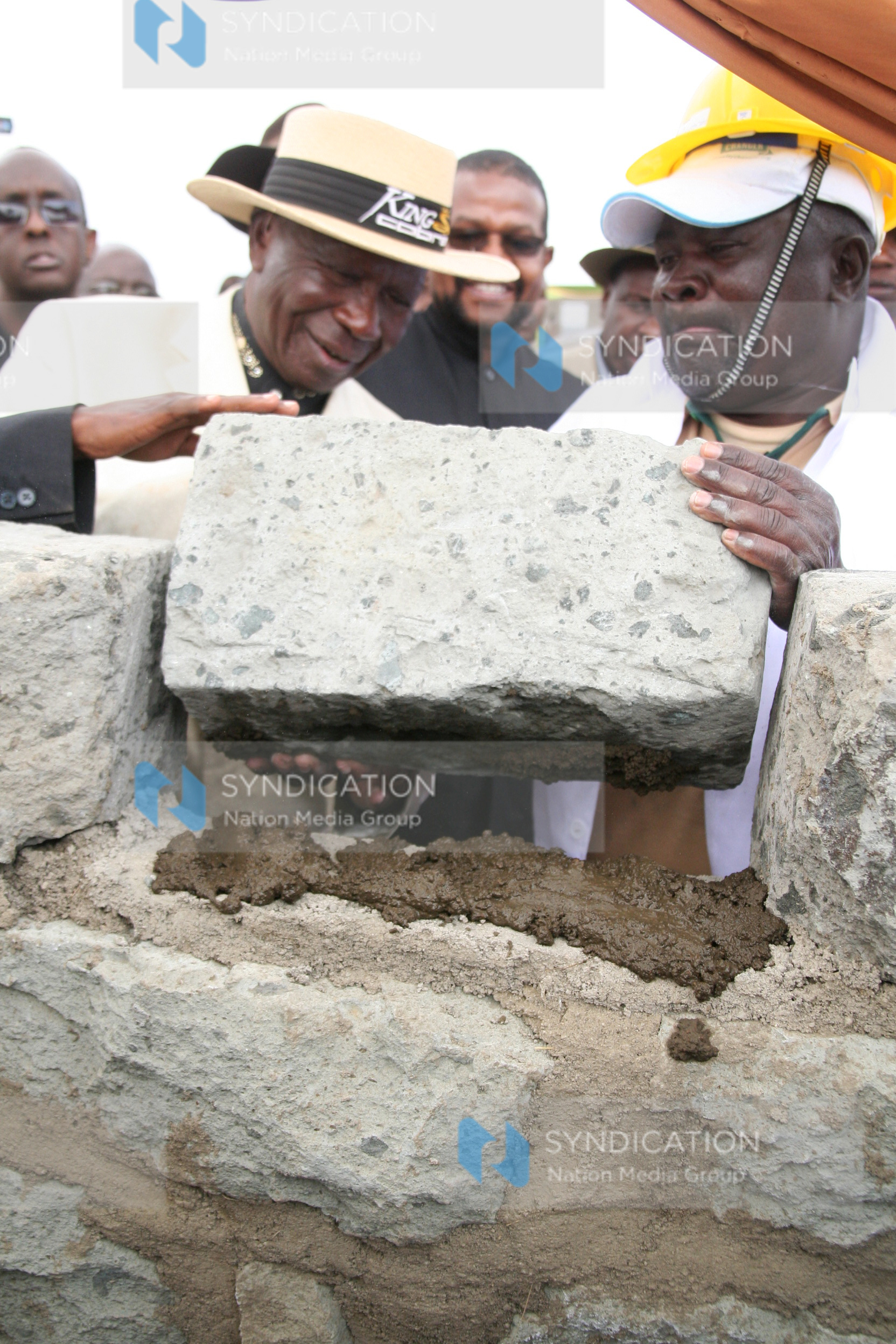 Former Vice President Moody Awori (left) joins in laying of the foundation stone