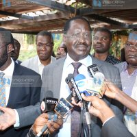 Raila Odinga (center), address the press