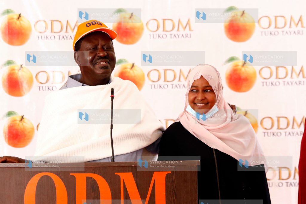 Raila Odinga (left) introduces Halima Daro ODM National Executive Council (NEC) Marsabit