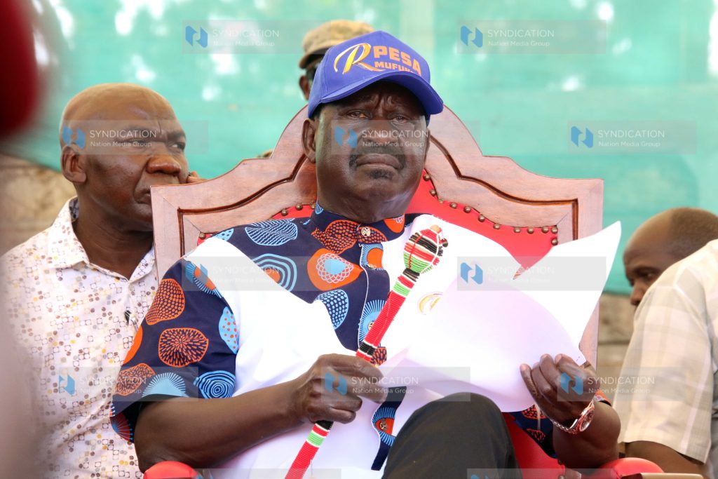 Raila Odinga follows proceedings during a campaign rally in Marsabit Town