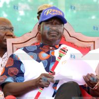 Raila Odinga follows proceedings during a campaign rally in Marsabit Town