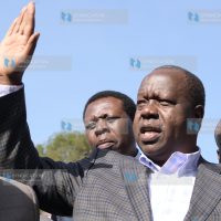 Fred Matiang'i gestures after leaving DCI headquarters