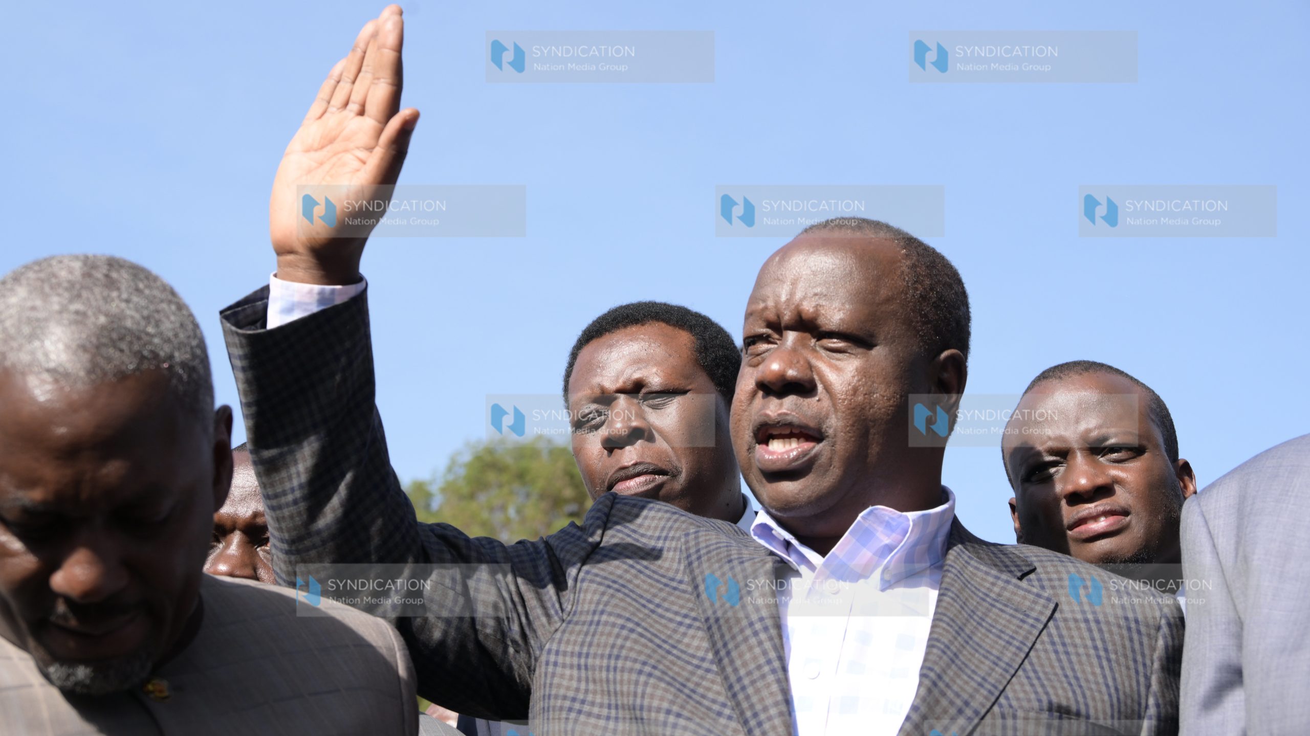 Fred Matiang’i gestures after leaving DCI headquarters