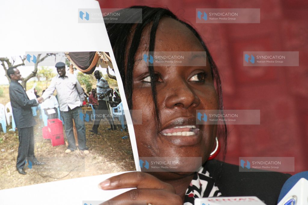 Tourism assistant minister Cecily Mbarire displays a photo