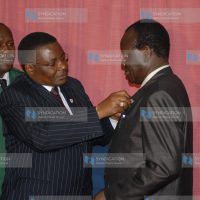 Charles Owino Omollo with the Head of State Commendation