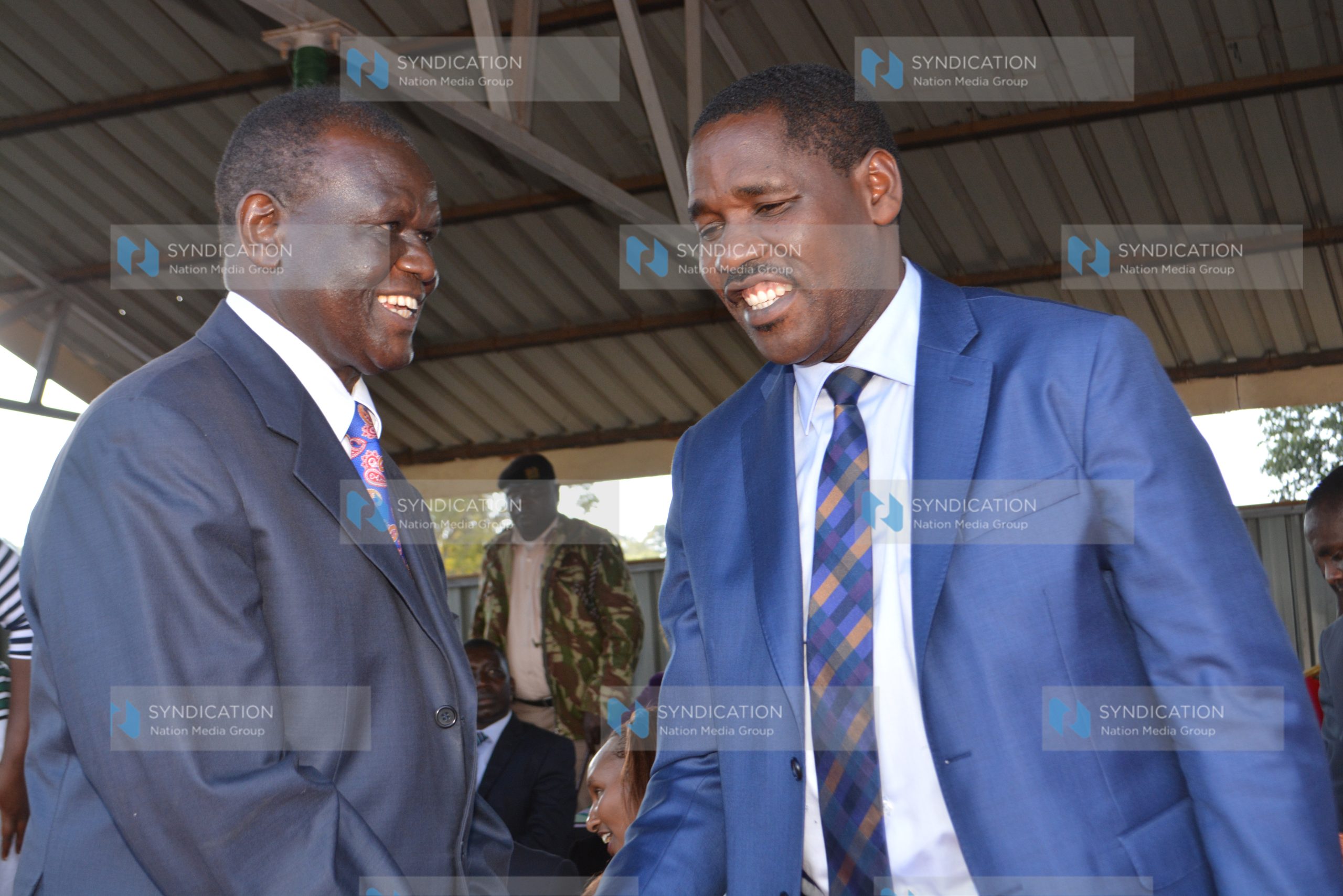 Peter Munya (right) and Senator Kiraitu Murungi chat at Meru Technical Training Institute