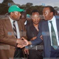 Deputy prime minister Uhuru Kenyatta, right, shakes hands with environment minister