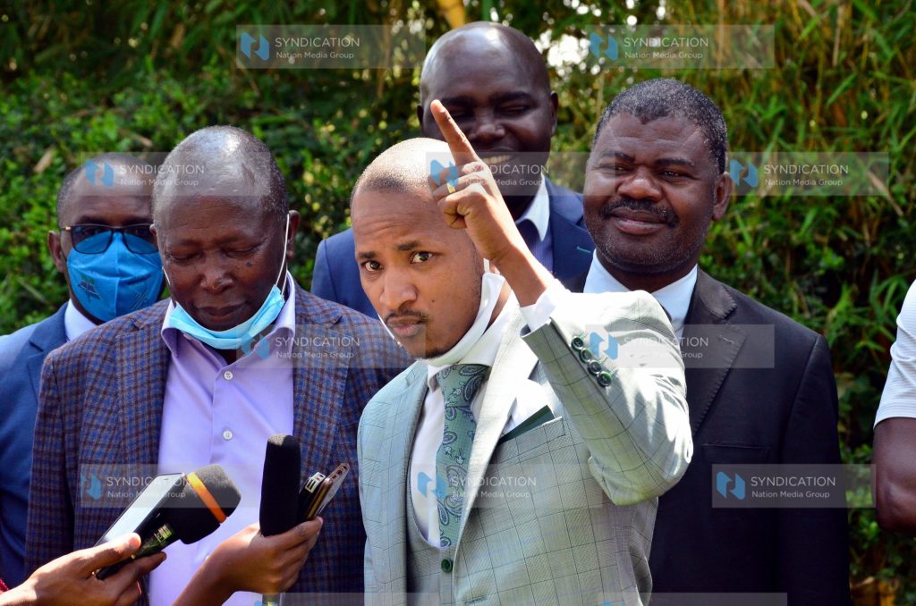 Embakasi East MP Babu Owino (right) gestures during a press conference