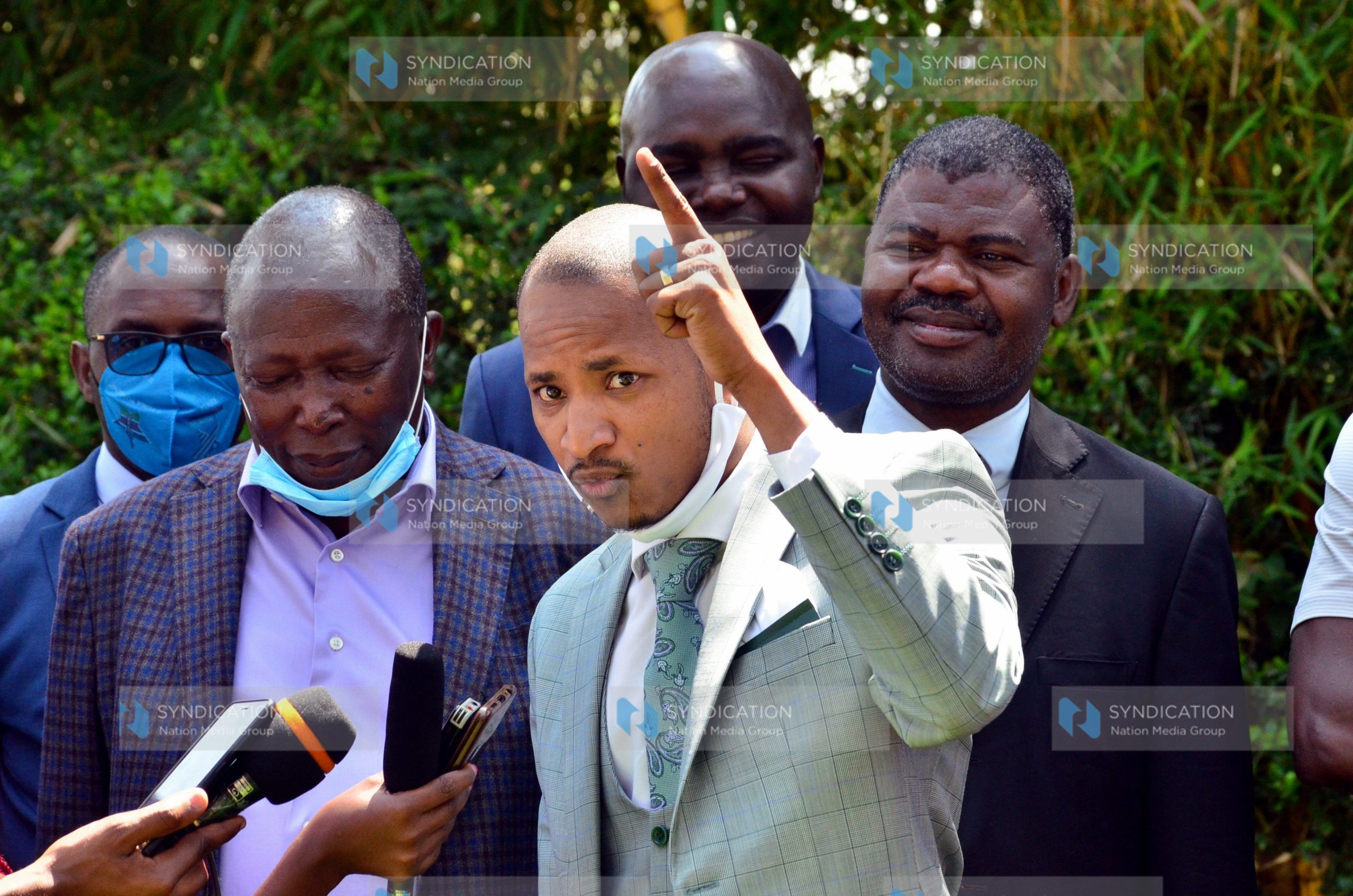 Embakasi East MP Babu Owino (right) gestures during a press conference