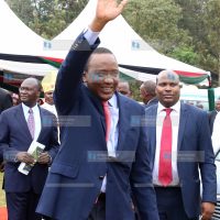 President Uhuru Kenyatta waves at catholic faithful at Mumbi grounds