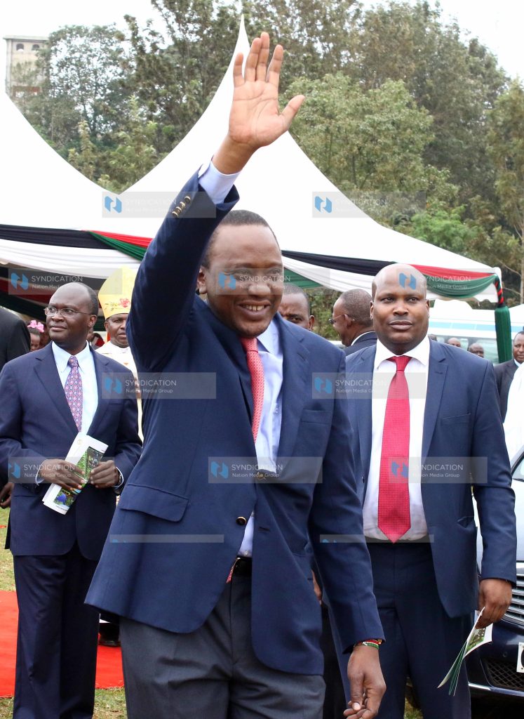 President Uhuru Kenyatta waves at catholic faithful at Mumbi grounds