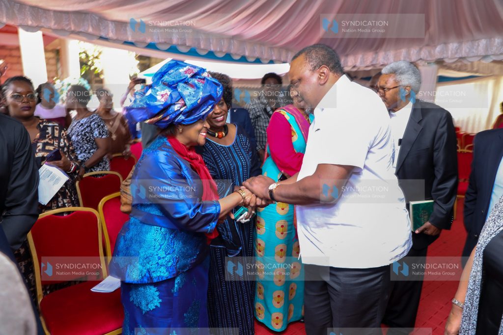Uhuru Kenyatta condoles with Dr Barbara Odudu Magoha (left)