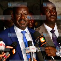 Raila Odinga (left) addressing media