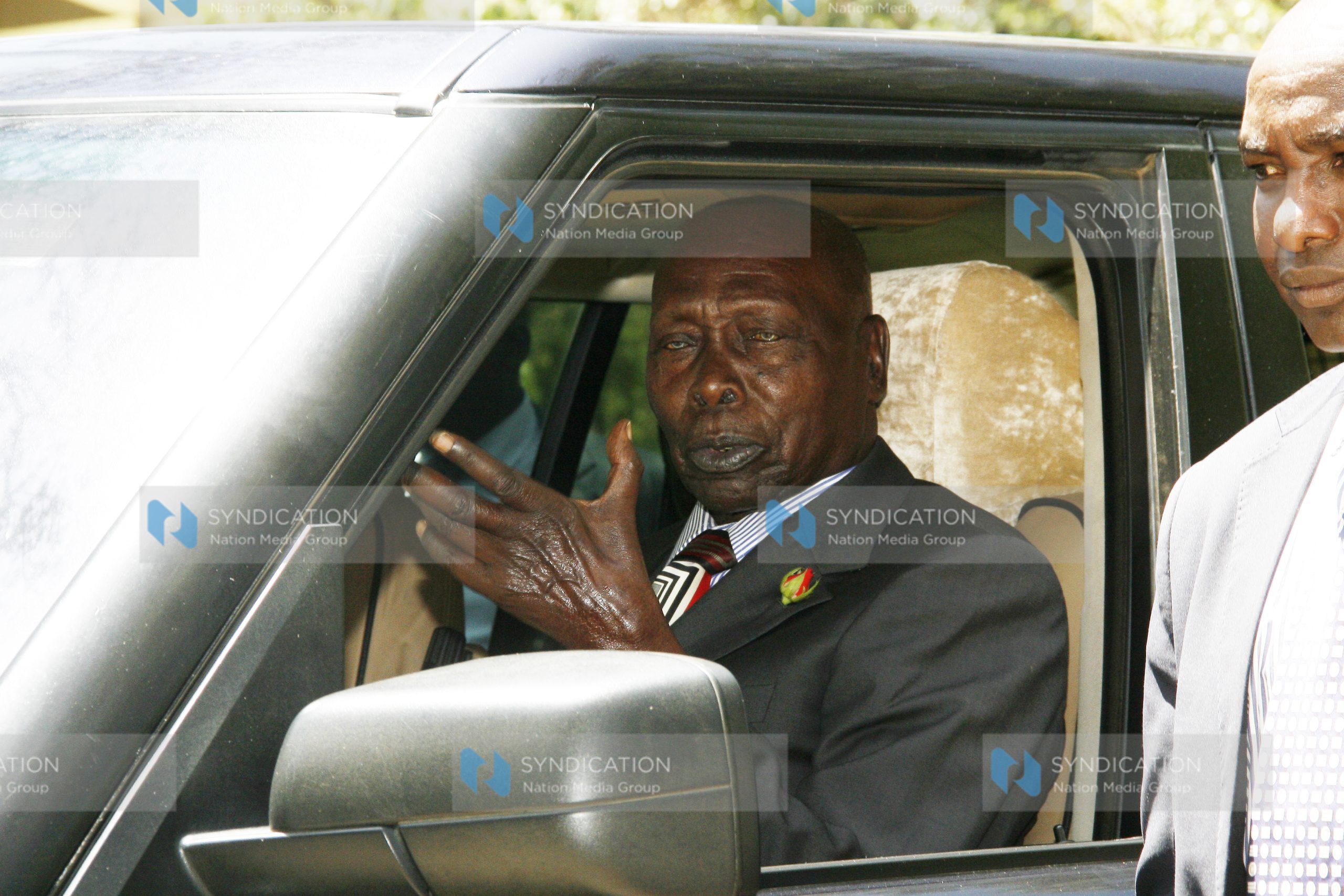 Former President Daniel Arap Moi (C) leaves the AIC Kabarak Community Chapel