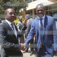 Mwangi wa Iria and Jubilee Party secretary general Raphael Tuju shake hands after addressing journalists