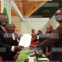 Nairobi Senatorial Aspirant on Jubilee ticket Johnson Sakaja receiving clearance certificate from the IEBC Nairobi County returning officer Joseph Eroo