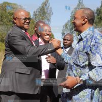 President Uhuru Kenyatta greets Kenya Pipeline chairman Daniel Wamahiu