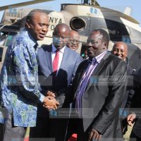 President Uhuru Kenyatta greets Nyeri governor Nderitu Gachagua