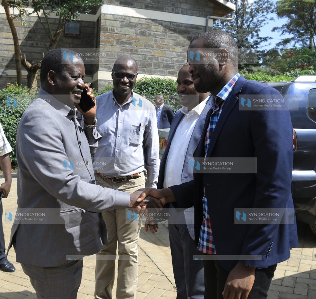 ODM leader Raila Odinga is welcomed by the party's Secretary General Edwin Sifuna and the Chairman, John Mbadi