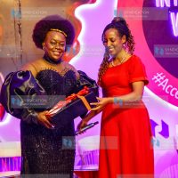NMG Head of Broadcasting Simaloi Dajom gifts Suba North MP Millie Odhiambo Mabona during the International Women's Day Gala dinner