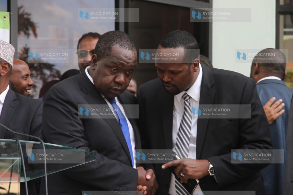 Interior Cabinet secretary Fred Matiang'i with Mandera County Governor Ali Roba (right)