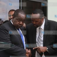 Interior Cabinet secretary Fred Matiang'i with Mandera County Governor Ali Roba (right)