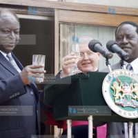 President Mwai Kibaki (left) is joined by Prime minister Raila Odinga (right)