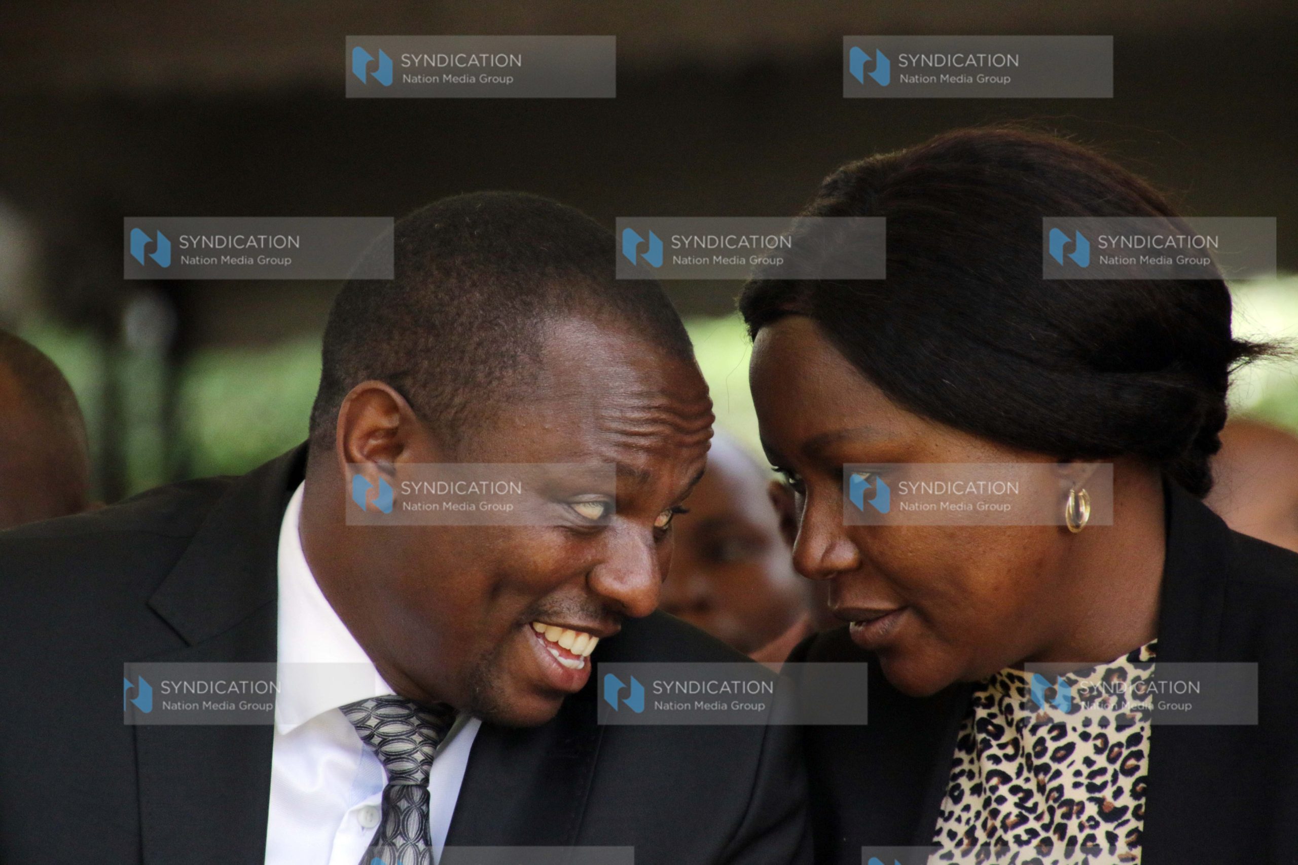 Kikuyu MP Kimani Ichung’wa chats with nominated MP Cecily Mbarire (right)