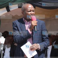 Gatundu South MP Moses Kuria addressing mourners