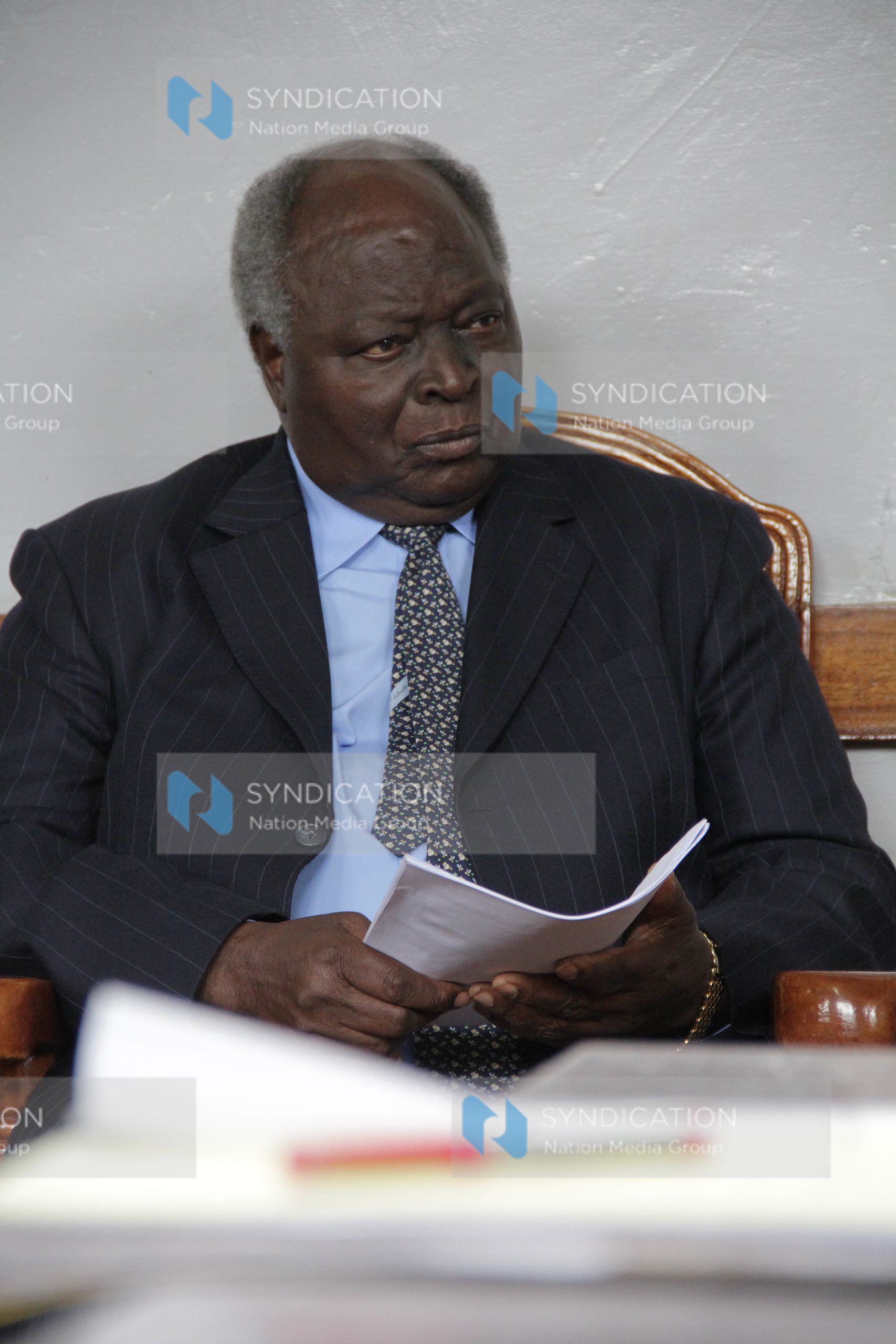 Former President Mwai Kibaki follows proceedings at Nyeri High Court