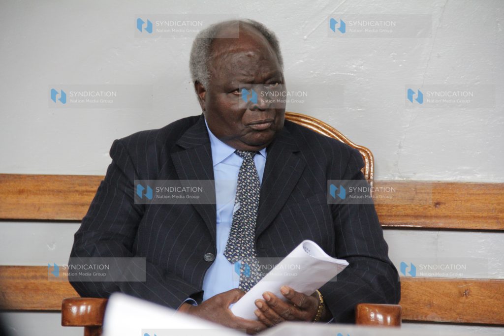 Former President Mwai Kibaki follows proceedings at Nyeri High Court