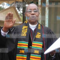 Retired clergy Timothy Njoya sings a hymn