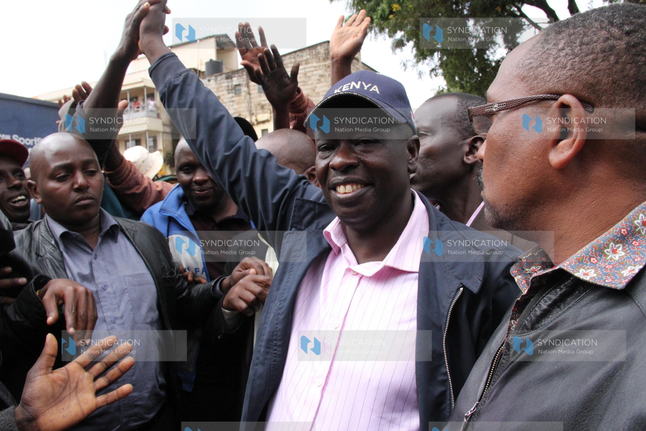 Rigathi Gachagua (in blue cap) celebrates his win in Karatina Town