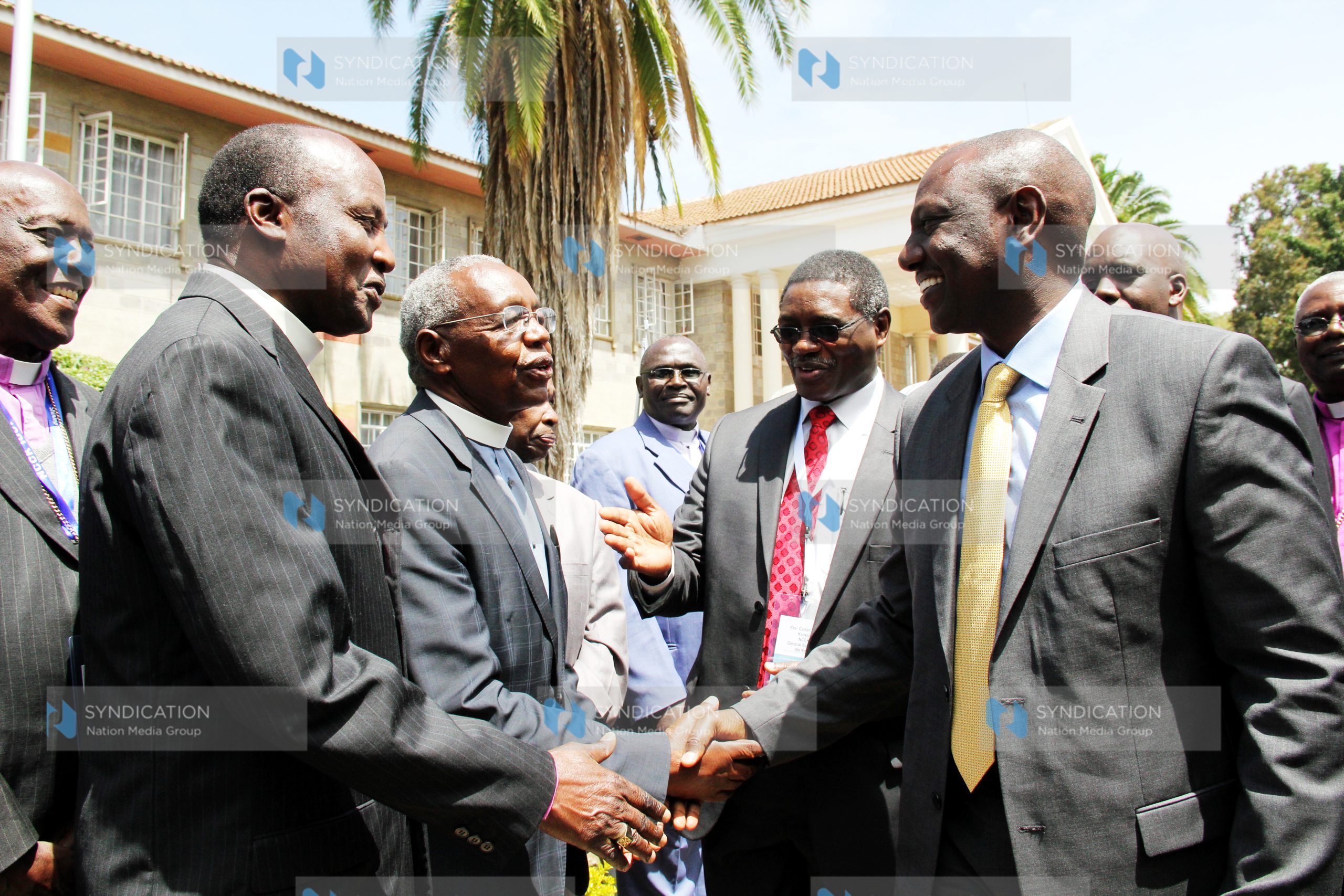 Deputy President William Ruto and the National Council of Churches of Kenya General Secretary Rev. Canon Peter Karanja greet Rev. Timothy Njoya