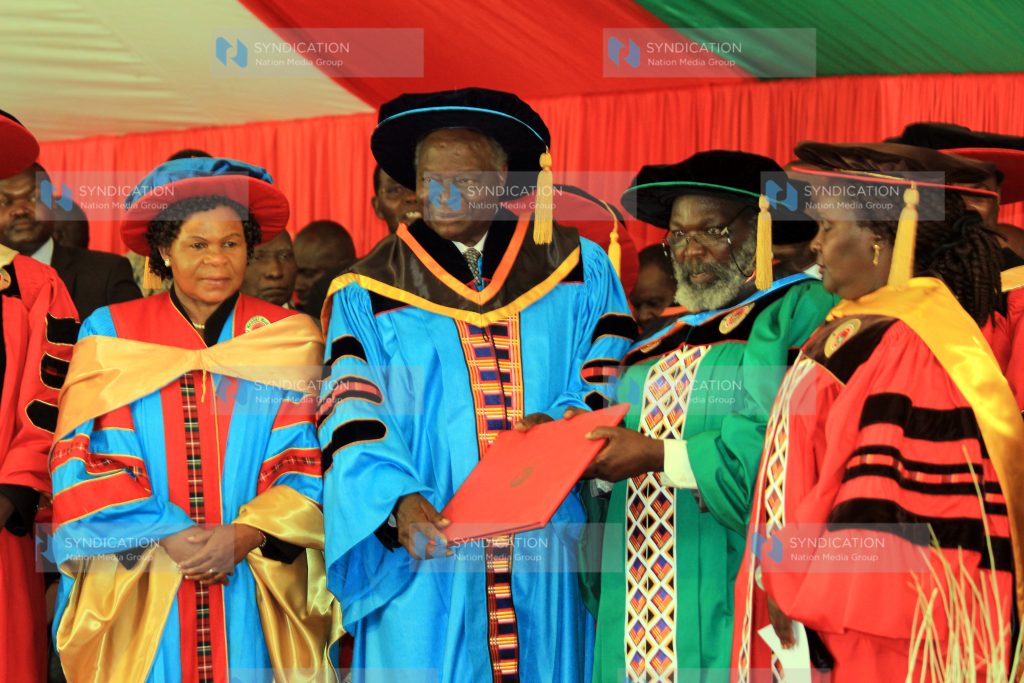 Former President Mwai Kibaki being conferred with an honorary degree