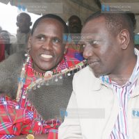 Agriculture Minister William Ruto confers with politician Martine Ole Kamwaro