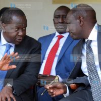 Deputy President William Ruto talking to Education Cabinet Secretary Fred Matiang'i