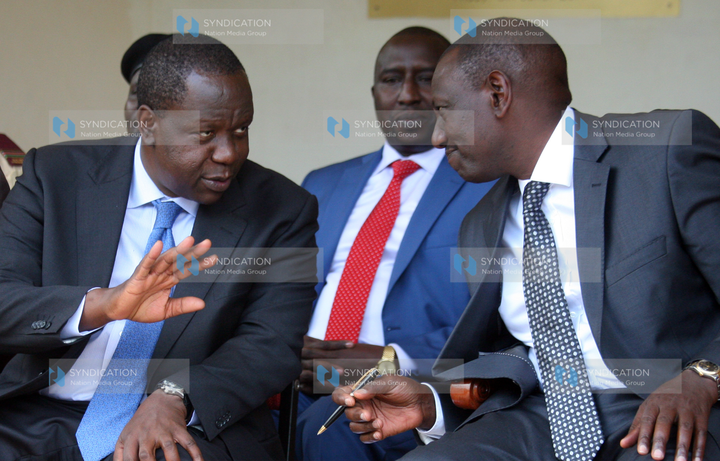 Deputy President William Ruto talking to Education Cabinet Secretary Fred Matiang’i