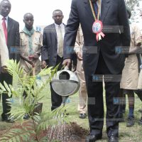 Minister of State Provincial Administration and Internal Security George Saitoti waters a plant