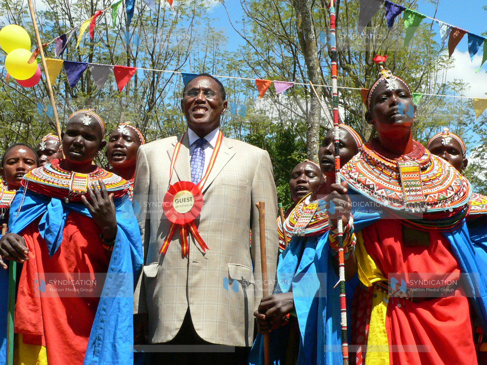 Internal security minister George Saitoti joins Samburu dancers