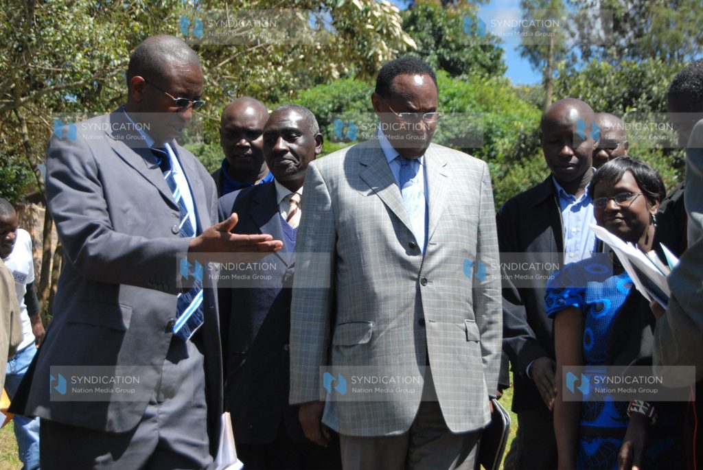 Internal Security Minister and MP for Kajiado North Hon. George Saitoti are shown the way by Mr. Stephen Ndoria