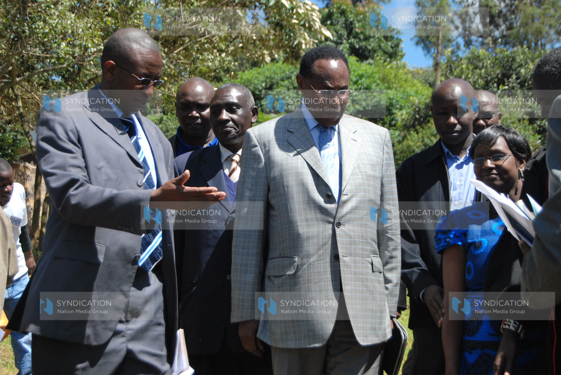 Internal Security Minister and MP for Kajiado North Hon. George Saitoti are shown the way by Mr. Stephen Ndoria