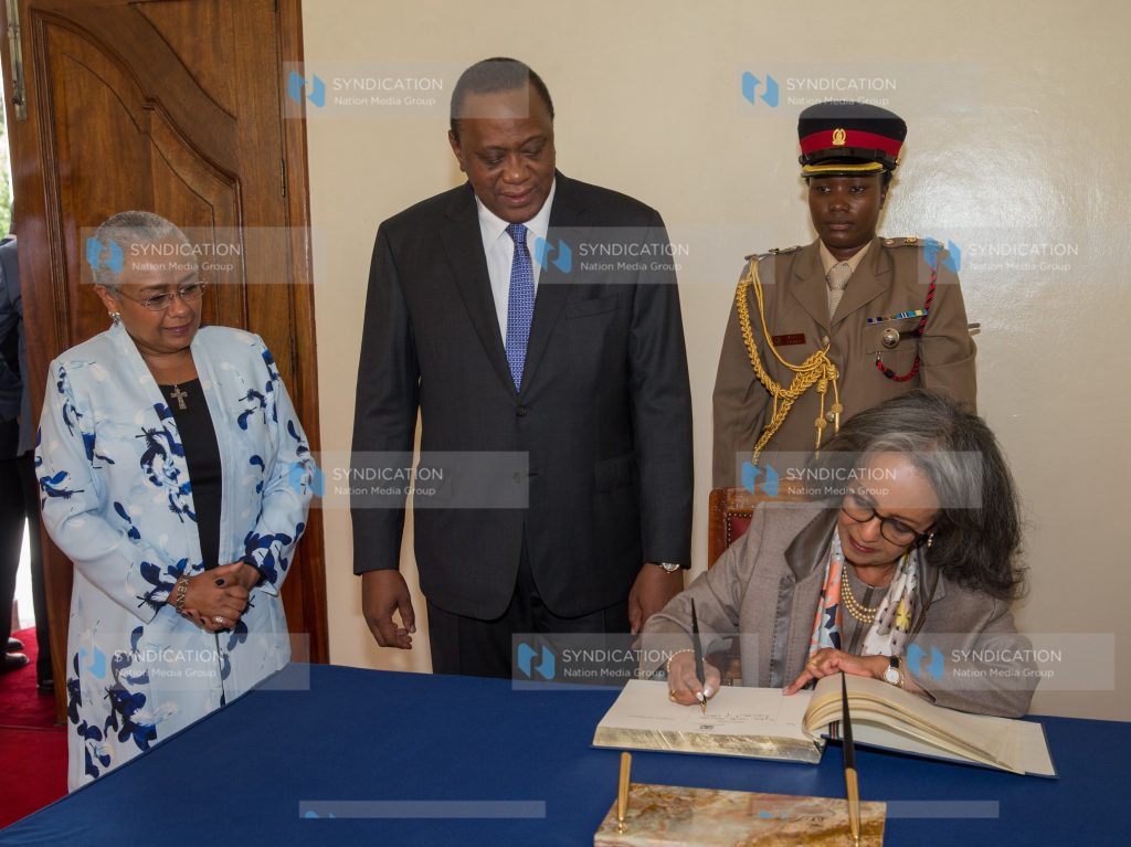 Her Excellency Sahle-Work Zewde, President of the Federal Democratic Republic of Ethiopia signs the Visitor's Book moments after being received by President Uhuru Kenyatta and First Lady Margaret Kenyatta