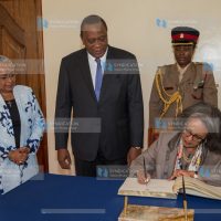 Her Excellency Sahle-Work Zewde, President of the Federal Democratic Republic of Ethiopia signs the Visitor's Book moments after being received by President Uhuru Kenyatta and First Lady Margaret Kenyatta