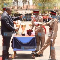President Uhuru Kenyatta awards Mary Wanjiku Nduati for being the Best Officer Cadet in Leadership and Command