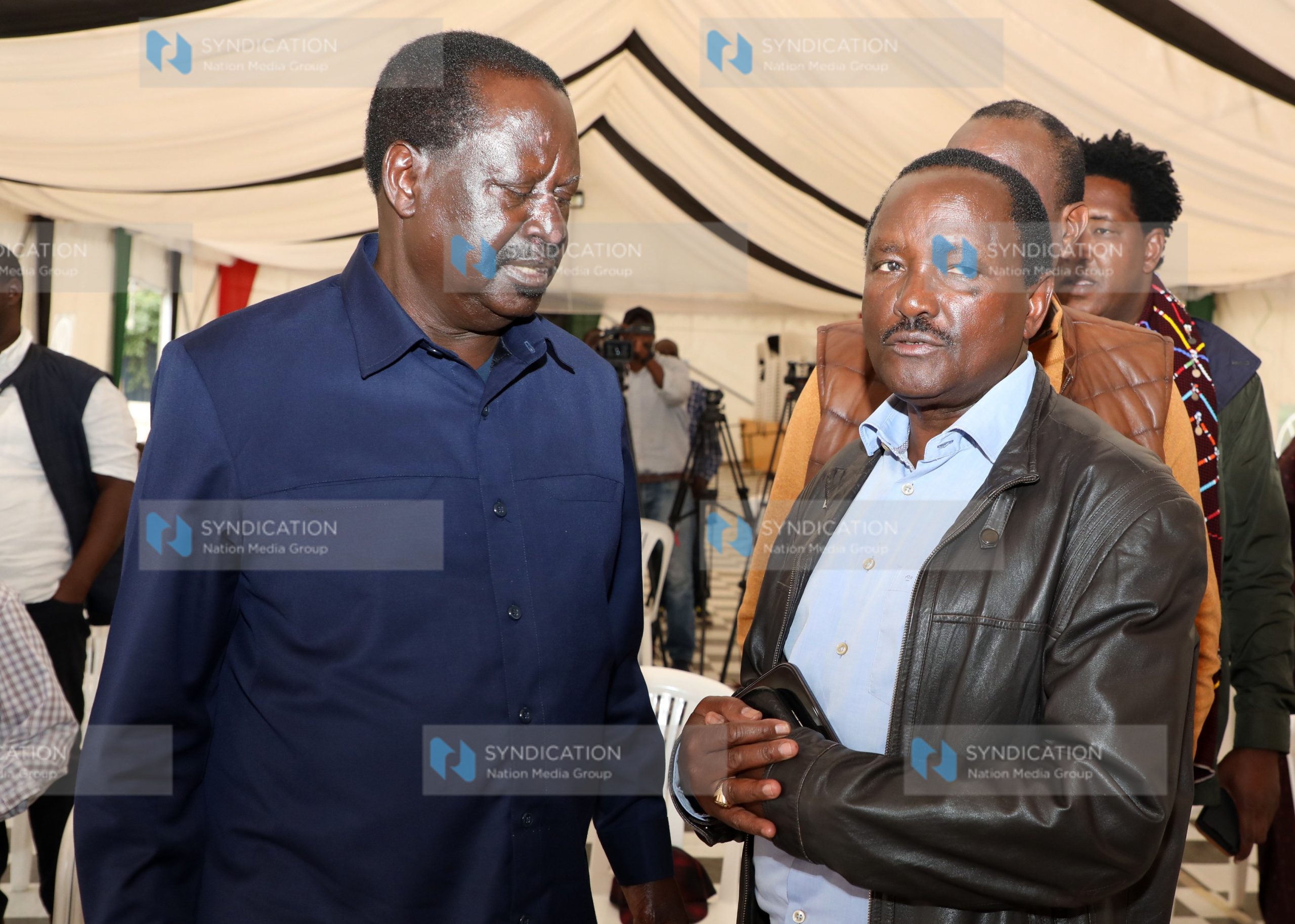 Raila Odinga [left] shares a word with Wiper Party Leader Kalonzo Musyoka