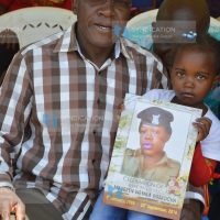 Dr. Boni Khalwale (left) addresses mourners at Lurambi village