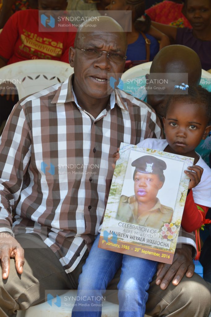 Dr. Boni Khalwale (left) addresses mourners at Lurambi village