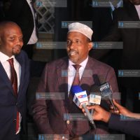 Aden Duale address the media outside parliament buildings