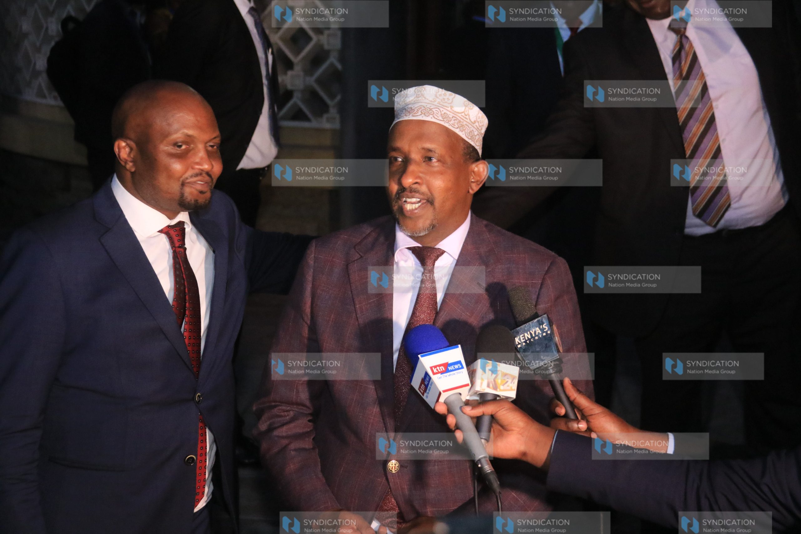 Aden Duale address the media outside parliament buildings